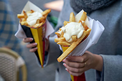 Close-up of hand holding ice cream