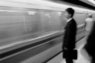 Blurred motion of train at railroad station