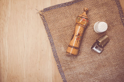 Directly above shot sewing equipment with jute on table