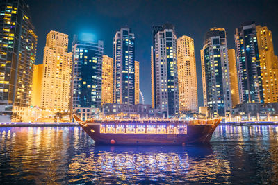 Illuminated buildings in city at night