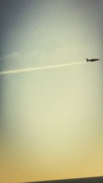 Low angle view of airplane flying in sky