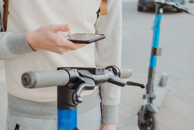 Midsection of man repairing bicycle