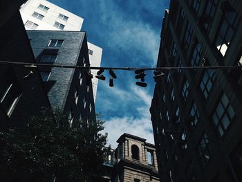 Low angle view of building against cloudy sky