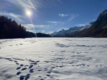 Scenic view of snow covered mountains against sky