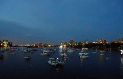 Boats in harbor at night