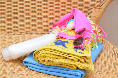 High angle view of multi colored clothing and personal accessories on table