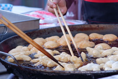 Close-up of person preparing food