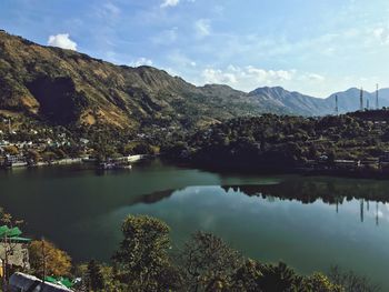 Scenic view of lake and mountains against sky