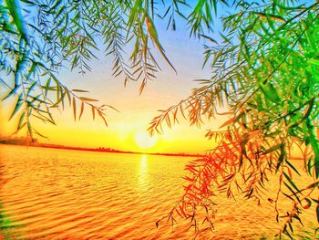 Scenic view of sea against sky at sunset