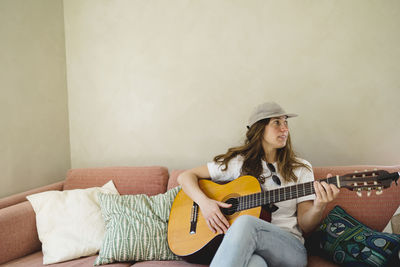 Woman playing guitar