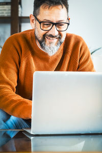 Man using laptop at home