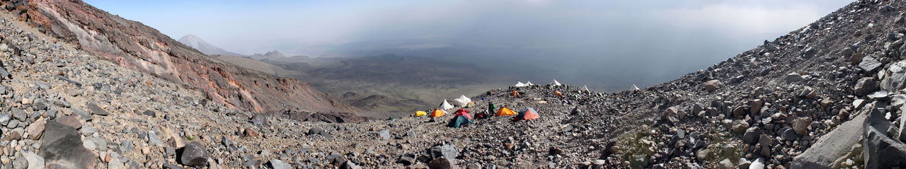 Panoramic view of rocky mountains against sky