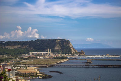 Scenic view of sea and buildings against sky