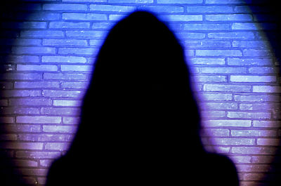 Woman standing on wall