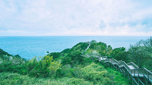 Wood bridge towards harbor of sea
