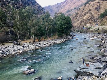 High angle view of river flowing through rocks