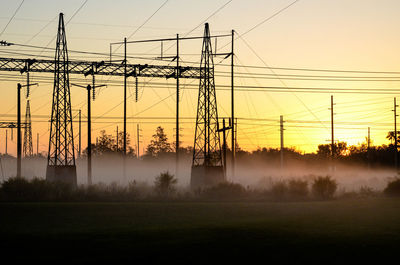 Sunrise through fog industrial scene