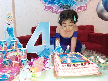 High angle view of girl having cake