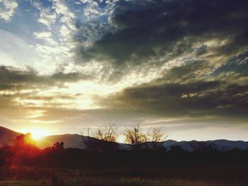 Scenic view of landscape against cloudy sky