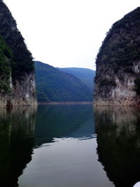 Reflection of trees in calm lake
