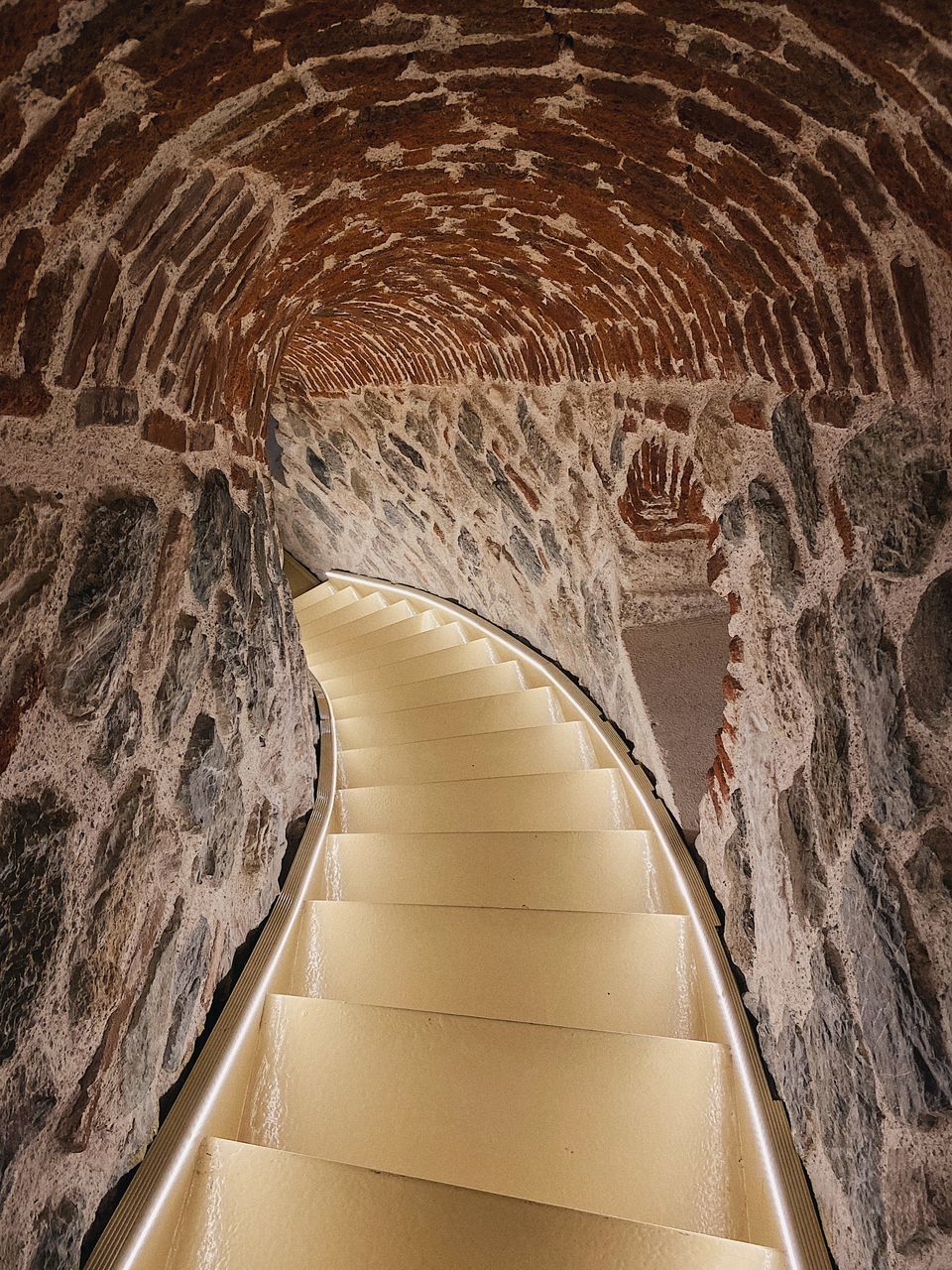 HIGH ANGLE VIEW OF ILLUMINATED TUNNEL