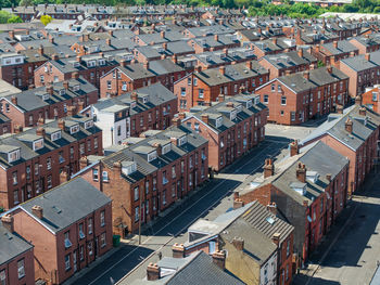 Aerial view of the rooftops of back to back terraced houses on residential estate in north england