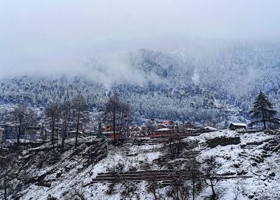 High angle view of snowcapped mountain against sky