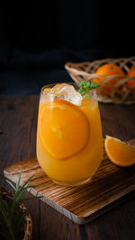 Homemade orange juice on cutting board