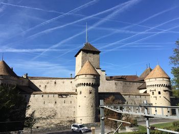 Low angle view of old building against blue sky