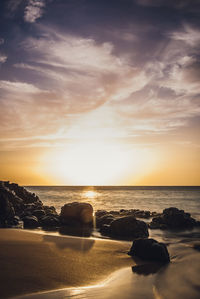 Scenic view of sea against sky at sunset