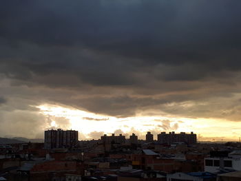 Cityscape against sky during sunset