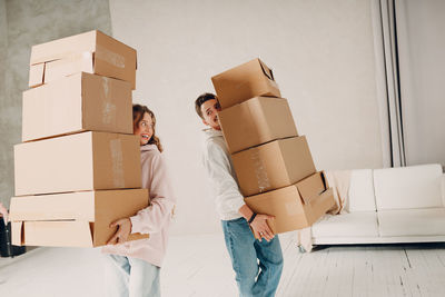 Low section of woman holding gift box