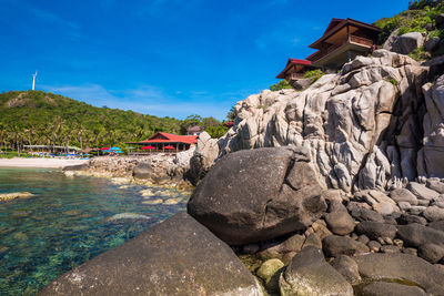 Scenic view of beach against blue sky