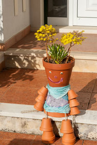 Potted plant by flower pot