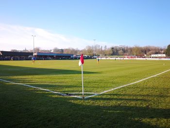 Scenic view of soccer field against sky