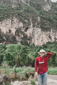 Portrait of a man standing on rock