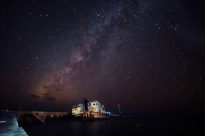 Scenic view of sea against sky at night