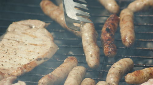 High angle view of hot dog on barbecue grill