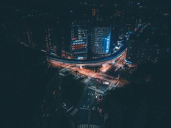 Aerial view of illuminated city at night