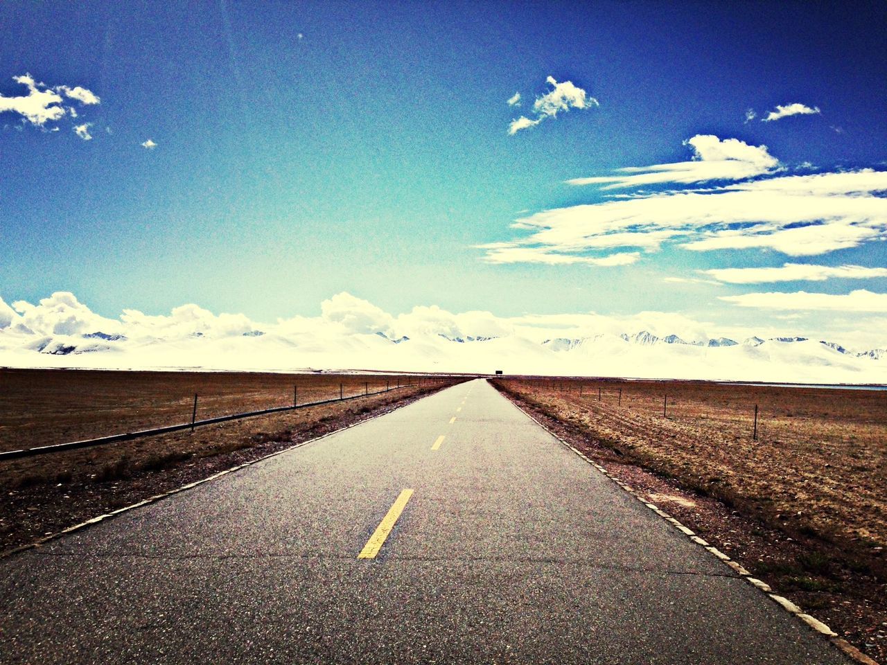 the way forward, road, blue, diminishing perspective, landscape, tranquil scene, sky, vanishing point, tranquility, road marking, transportation, scenics, asphalt, mountain, nature, empty, beauty in nature, country road, horizon over land, desert