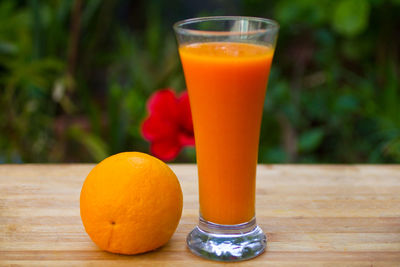 Close-up of orange juice on table