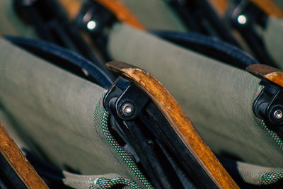 Close-up of chairs arranged indoors