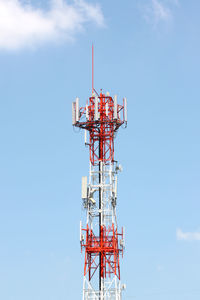 Low angle view of communications tower against sky