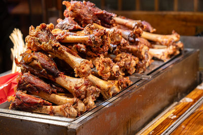 Close-up of meat on barbecue grill