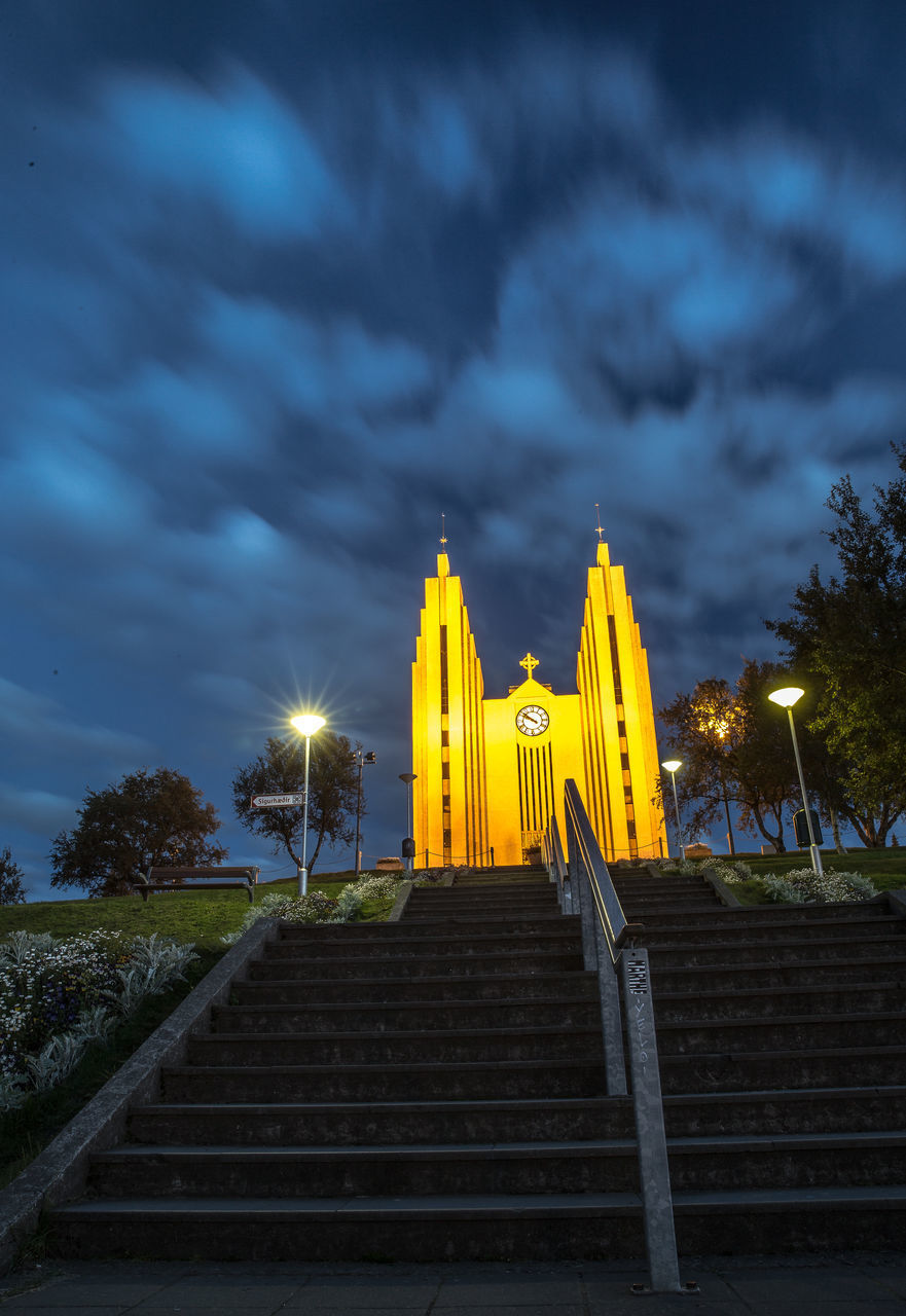 LOW ANGLE VIEW OF YELLOW STEPS AGAINST SKY