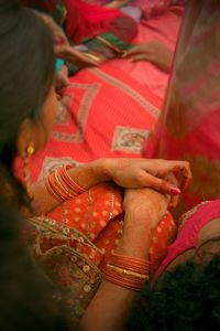 Close-up of young woman holding hands