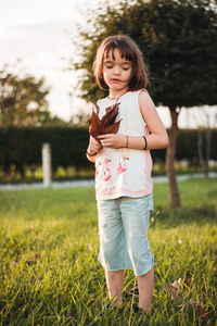 Little girl having fun outdoors in sunset