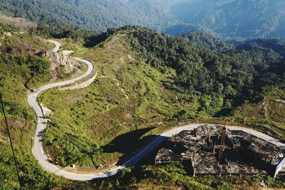 High angle view of road amidst mountains