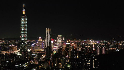 Illuminated buildings in city at night