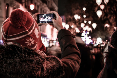 Rear view of people photographing